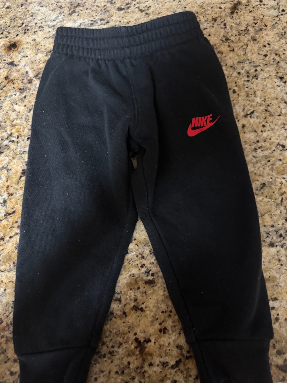 Nike Black Kids Sweatpants with Red Swoosh Logo